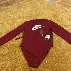 Nike body suit.   New with tags.   Never worn